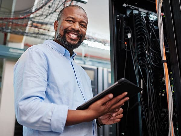 About Us Fidium Features 600x450 Field tech working outside home