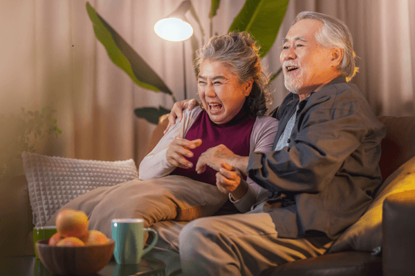 Blog couple laughing on couch Blog couple laughing on couch