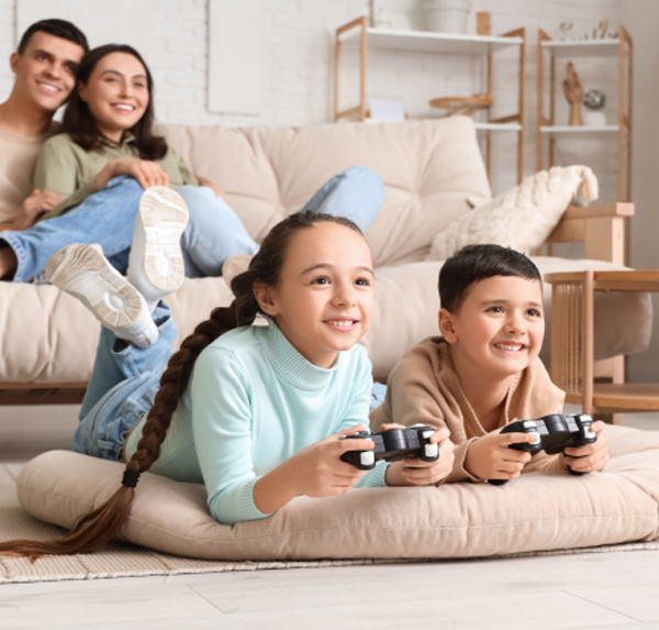 group of kids on couch playing video games